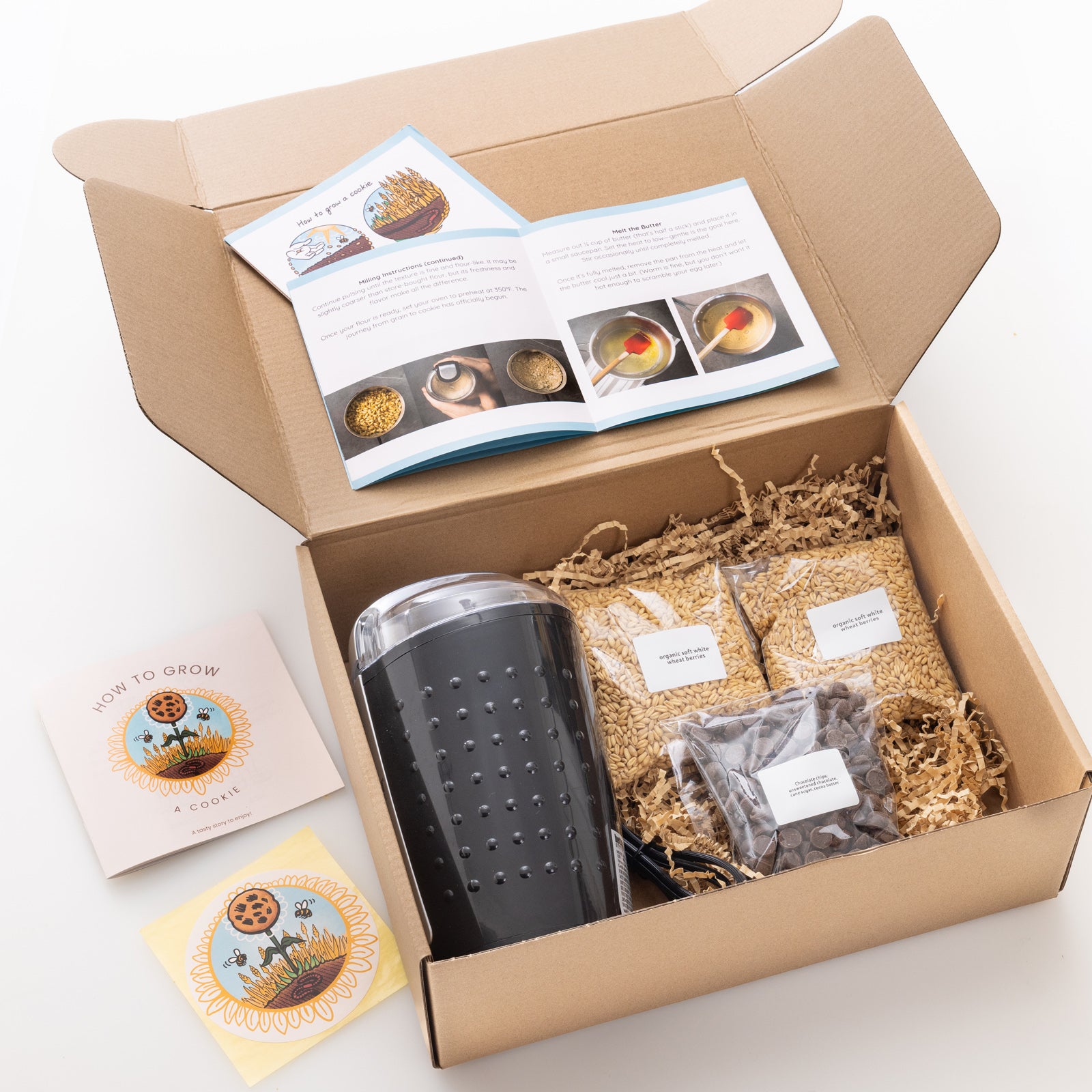 DIY cookie kit including coffee grinder, wheat berries, chocolate chips and instructions on how to "grow a cookie"